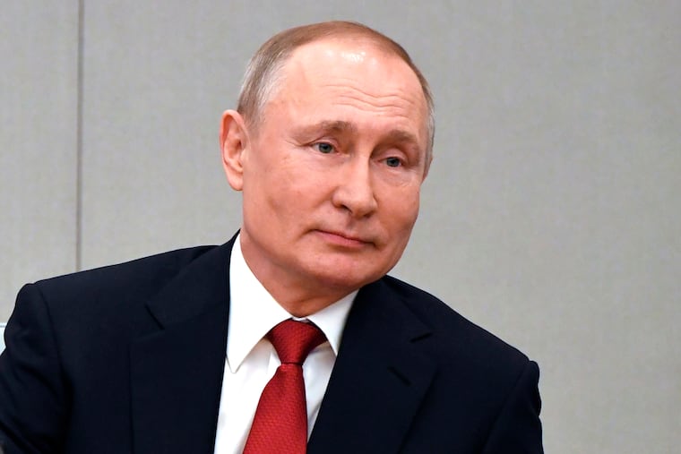 Russian President Vladimir Putin attends a session prior to voting for constitutional amendments at the State Duma, the Lower House of the Russian Parliament in Moscow, Russia, Tuesday, March 10, 2020. Putin says he supports a proposed constitutional amendment that would allow him to seek another term and remain in power.