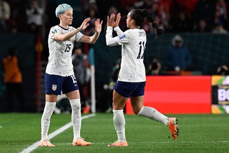 The United States' Megan Rapinoe (left) subs in for Sophia Smith during the group stage finale against Portugal. The USWNT played Portugal to a 0-0 draw to sneak into the round of 16.