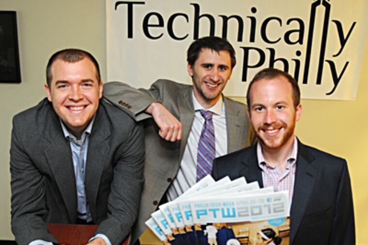 Co-founders of Technically Philly, the small Philly company that is coordinating Philly Tech Week (PTW), are (from left) Christopher Wink, Sean Blanda and Brian James Kirk, who is holding copies of PTW 2012, the guide magazine for events throughout the week of PTW. ( Clem Murray / Staff Photographer )