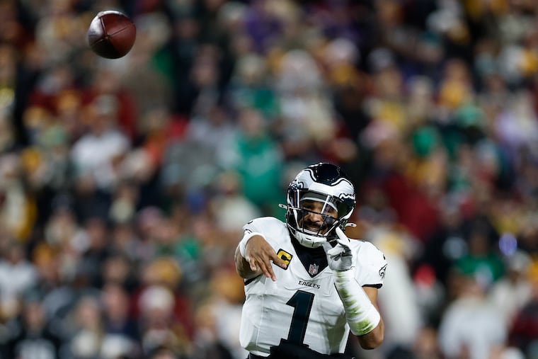 Eagles quarterback Jalen Hurts had a passer rating of 111.1 in the division-clinching win against Washington.