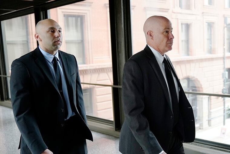 Former Minneapolis police officer J. Alexander Kueng (left) and his attorney, Thomas Plunkett, arrive for a court session on July 27, 2022, in St. Paul, Minn.