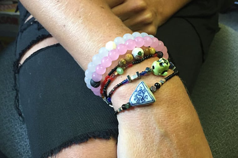 Holly Schoenfeld, 25, of Drescher, who includes two Lokais among the bracelets she wears every day, says "I stare at mine when I'm doing yoga."
