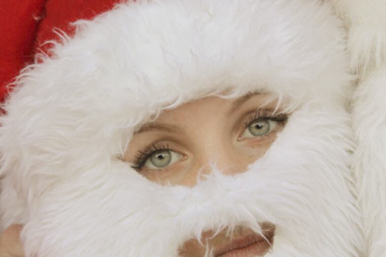 First-time Santa runner Kylie Moore waits for the run to begin. (Michael S. Wirtz / Staff Photographer)