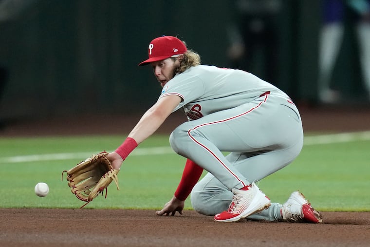 Phillies third baseman Alec Bohm fields a grounder hit by Arizona Diamondbacks' Tim Tawa.