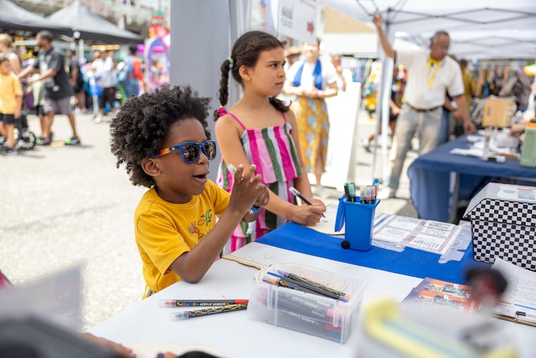 Kingkilliam Kato, 5, of Camden, N.J., is with his mom Annagjid Kato, at the Juneteenth Block Party at the African American Museum.