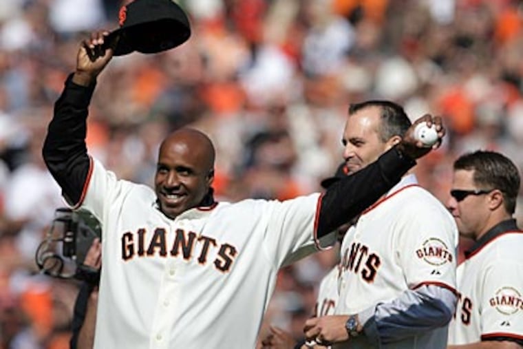 Barry Bonds threw out the first pitch for Game 3 of the NLCS - the first NLCS game the Giants had hosted since 2002. (Yong Kim / Staff Photographer)