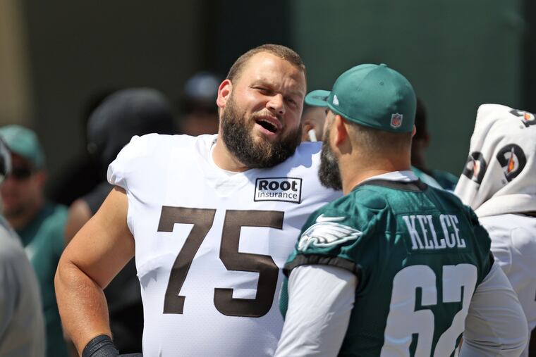Cleveland Browns guard Joel Bitonio and Eagles center Jason Kelce talk before the joint practice at training camp in Berea, Ohio.