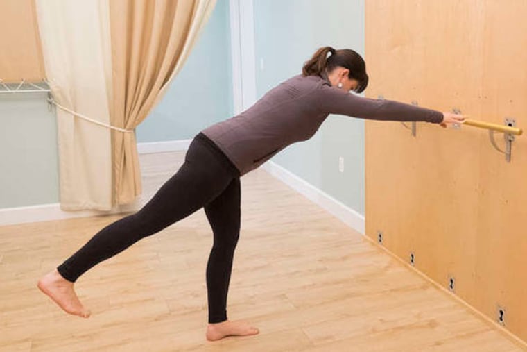 Biz Magarity, yoga therapist and owner of Nava Yoga, shows a recovery exercise. "Core muscles harness all the power muscles," says Meyers. Vincera research shows core injuries may make athletes prone to concussions.