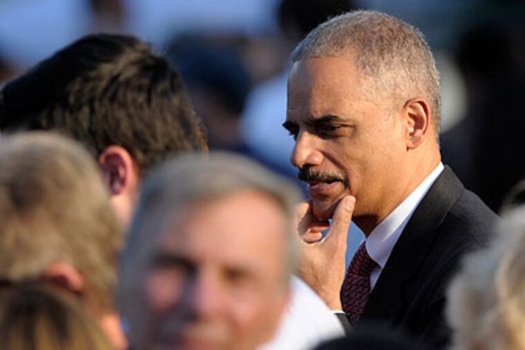 Attorney General Eric Holder attends the congressional picnic at the White House Wednesday, the day before the House of Representatives voted to hold him in contempt of Congress. (Susan Walsh / Associated Press)