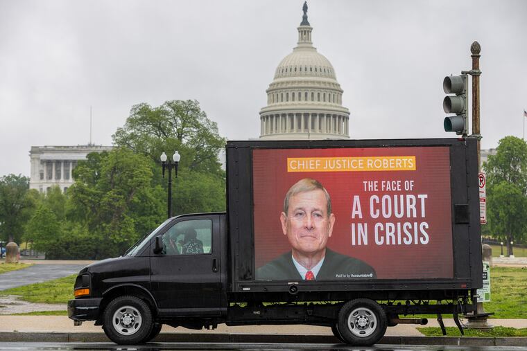 A mobile billboard showing Supreme Court Chief Justice John Roberts is seen outside the U.S. Capitol on April 28, 2023, in Washington, D.C.