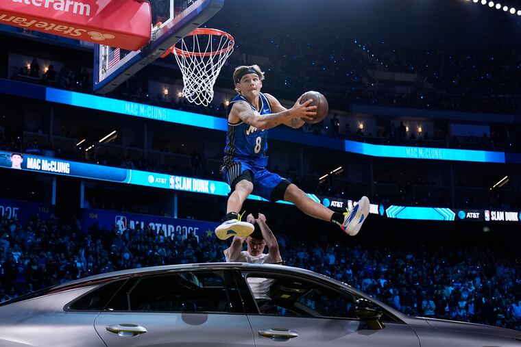 Mac McClung dunks over a car during the slam dunk contest at the NBA All-Star Saturday night festivities Saturday in San Francisco.