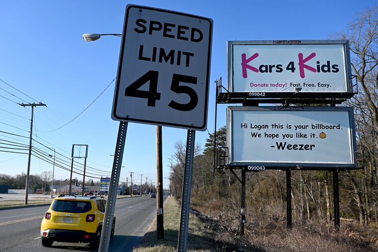 A billboard paid for by the rock band Weezer is photographed on the White Horse Pike in Berlin, N.J., on Tuesday.