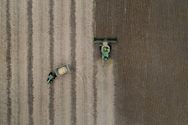 Soybeans are harvested with a Deere & Co. combine harvester in this aerial photograph taken above Tiskilwa, Ill., on Sept. 18, 2018.
