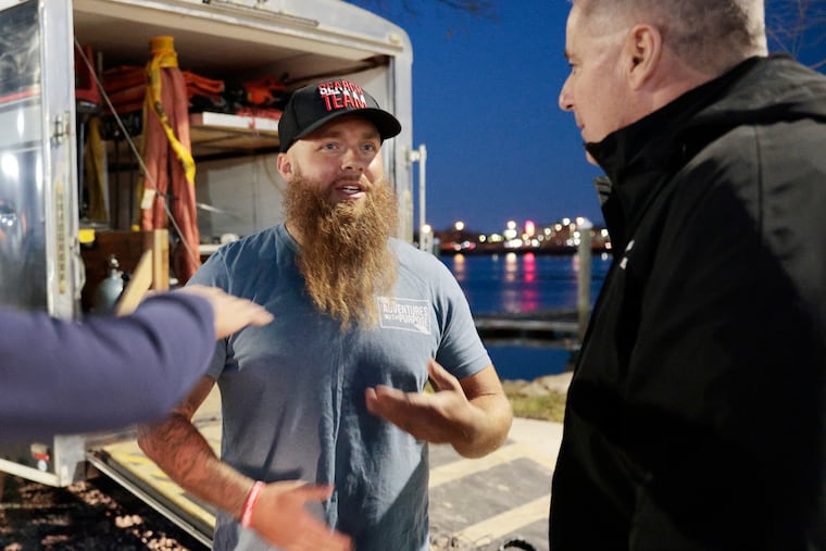 Doug Bishop of Adventures with Purpose (left) and Ridley Twp. Police Chief James Dougherty discuss recovery of a missing person and vehicle that were discovered by Bishop in the water at the Ridley Township Municipal Marina on Saturday.