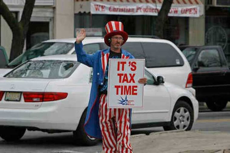 "Uncle Sam" - played here by Bill Addison, 42 - can be found all around, advertising tax preparers. Addison was at Lansdowne and Baltimore Avenues in Lansdowne. (File photo: Micheal S. Wirtz / Staff Photographer)