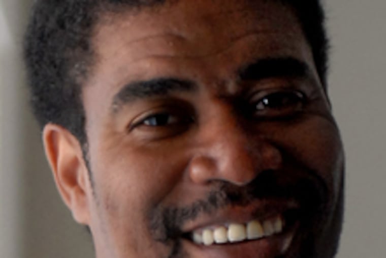 Pervis Ellison , above, works with the New Beginnings boys' basketball team. He has funded five scholarships.