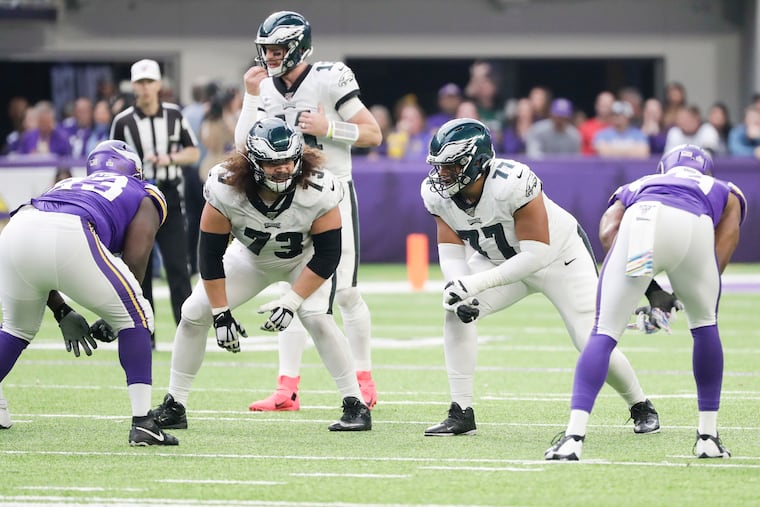 Eagles offensive linemen Isaac Seumalo (left) and Andre Dillard on the line against the Vikings on Sunday.