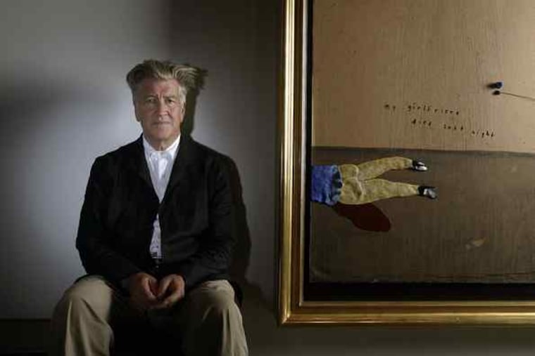 David Lynch sits next to his mixed-media work "Oh . . . I Have a New Shirt," among 13 new pieces, including the one at left, in a solo show at the Griffin in Santa Monica, Calif.