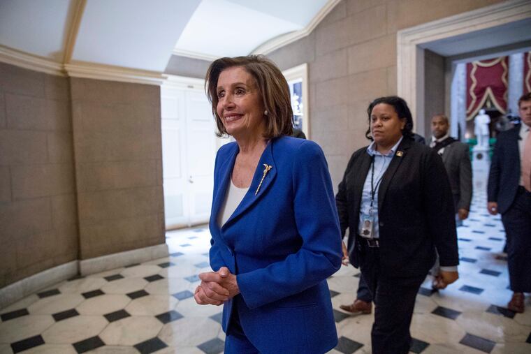 House Speaker Nancy Pelosi of Calif., walks to her office after signing the Coronavirus Aid, Relief, and Economic Security (CARES) Act last week.