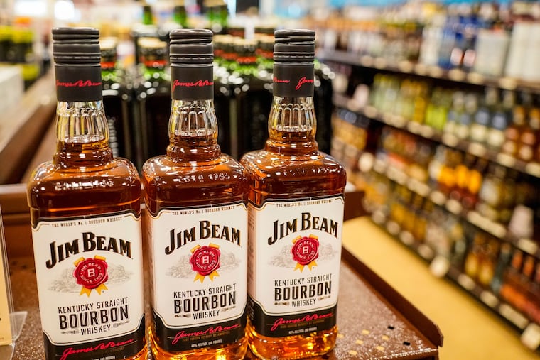A shelf displays bottles of Jim Beam bourbon for sale at a Fine Wine & Spirits store in 2022 in Harmony, Pa.
