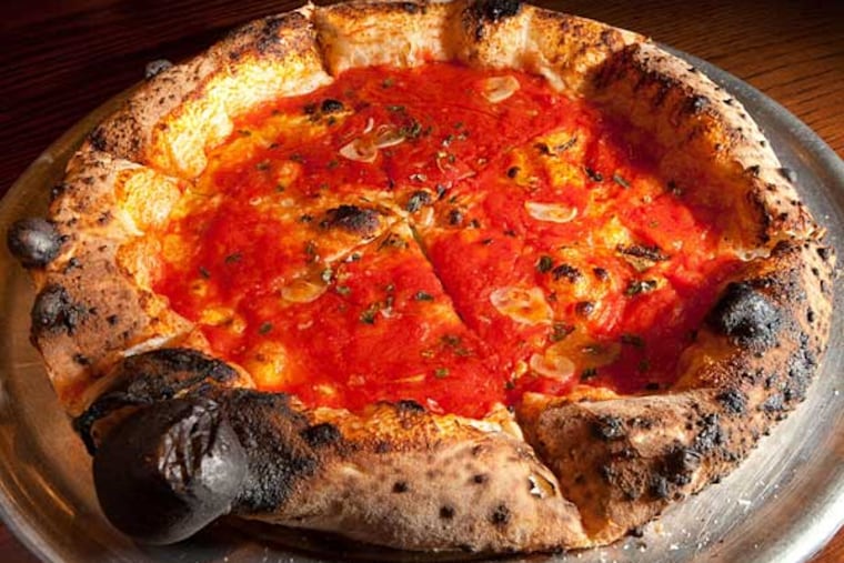 Contender for the city's best: A simple marinara pie topped with hand-crushed tomatoes, slivered garlic, and oregano at Pizzeria Vetri.