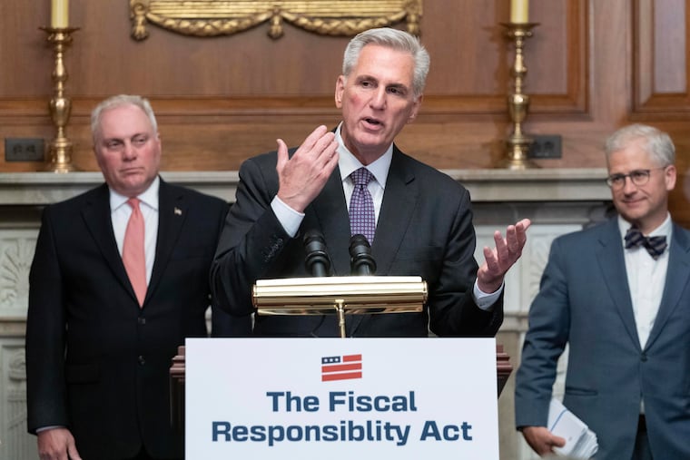 House Speaker Kevin McCarthy, R-Calif., speaks alongside House Minority Whip Rep. Steve Scalise, R.La., left, and Rep. Patrick McHenry, R-N.C.