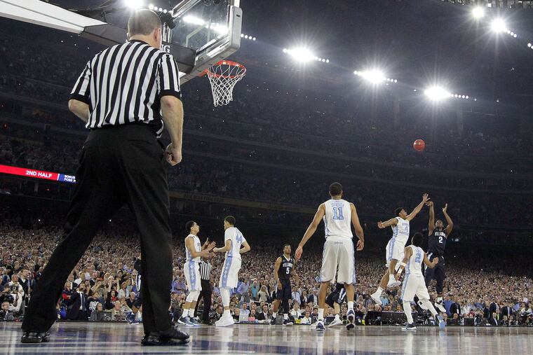 Villanova's Kris Jenkins shoots the game winning three point basket over North Carolina's Isiah Hicks and Joel Berry II in the NCAA championship at NRG Stadium on April 4, 2016.