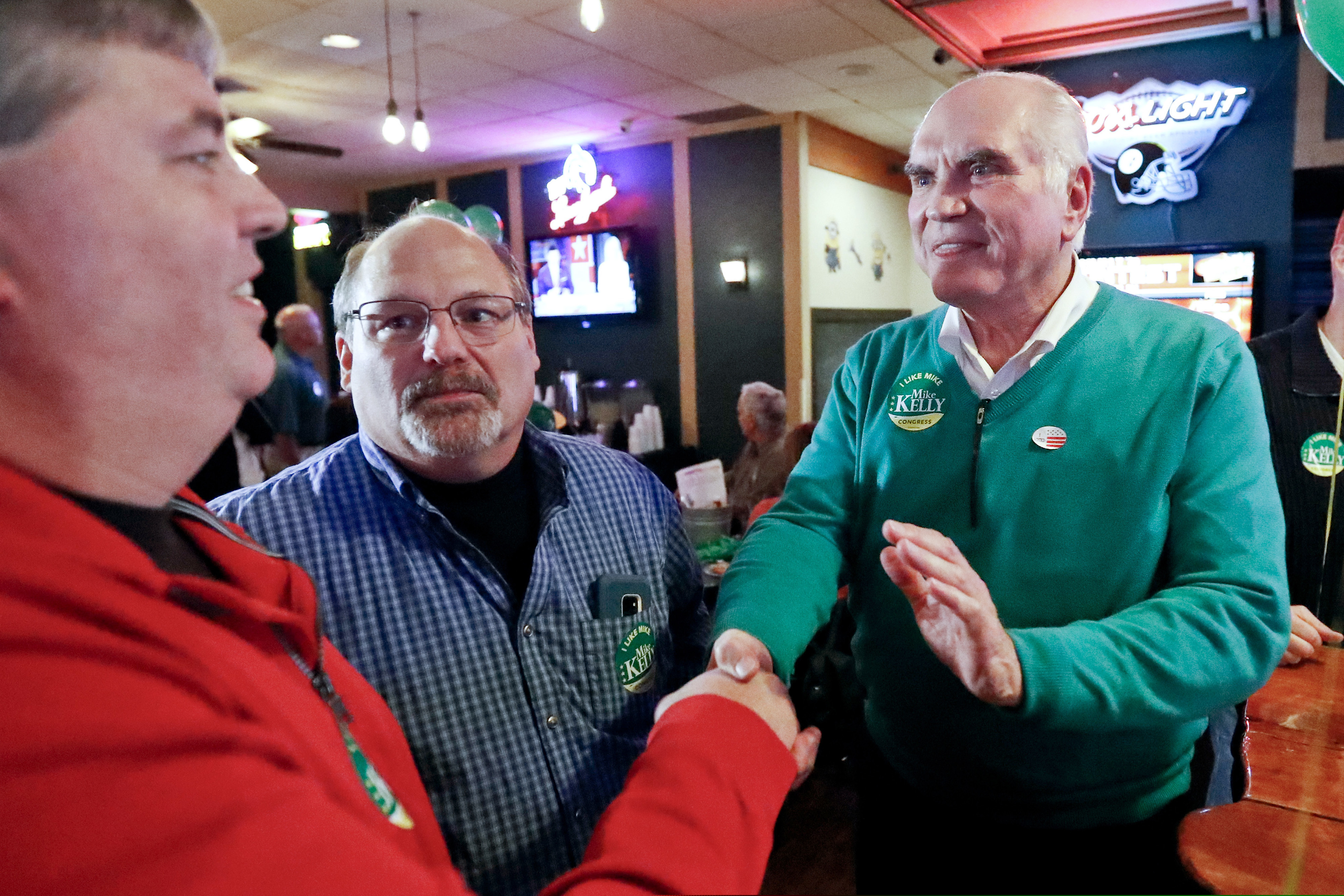 U.S. Rep. Mike Kelly (right) greets supporters at his election returns party last year, in Butler, Pa. He was one of the chief co-sponsors of the SECURE Act.