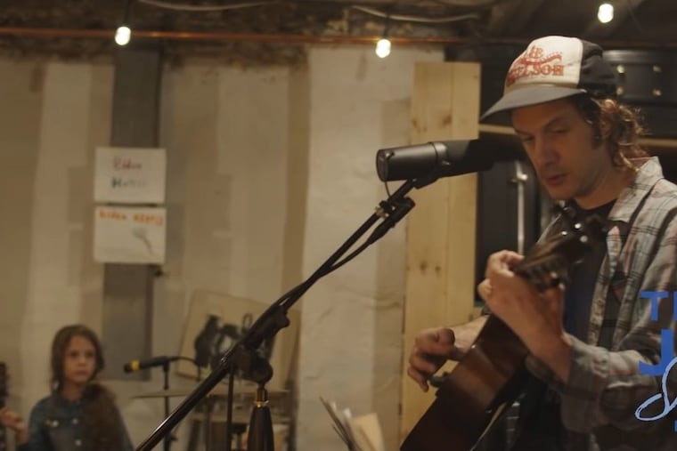 A screen shot of Kurt Vile and his daughter Delphine from their performance for the Team Joe Sings series.
