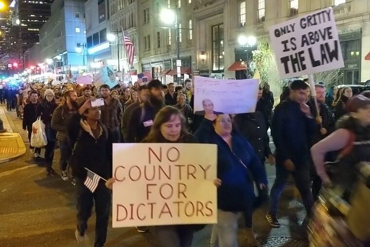 Hundreds of protesters marched Thursday night in Center City to show support for special counsel Robert Mueller.