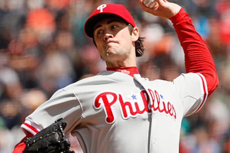 Cole Hamels allowed four runs on nine hits over six innings on Tuesday. (Eric Risberg/AP)