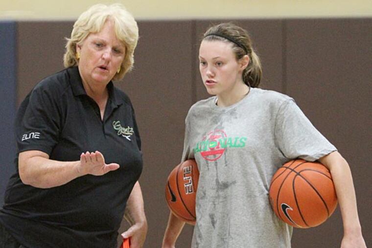 Immaculata star Theresa Grentz talks to Nicole Munger before having her run through a drill at Grentz Elite Coaching in West Chester. Grentz will be entering the Basketball Hall of Fame along with the "Mighty Macs" team.