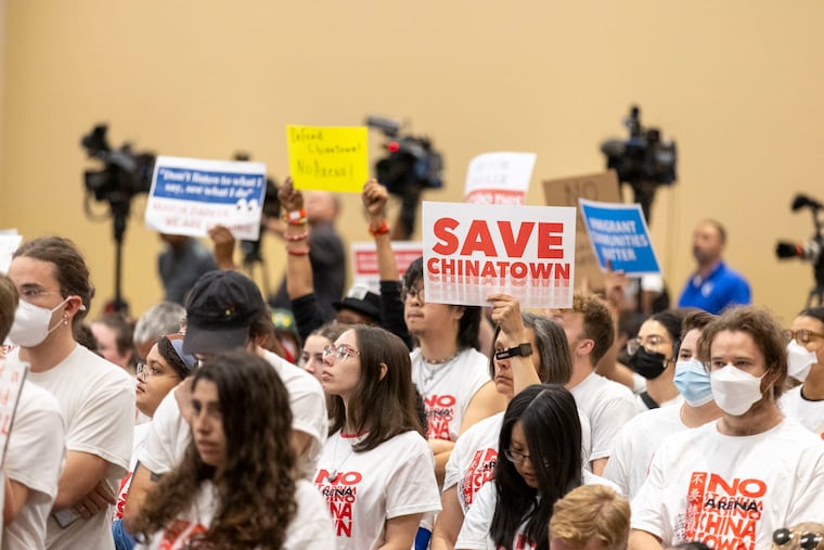 Supporters of Chinatown stand as community members of Chinatown speak during the town hall at the Pennsylvania Convention Center in Philadelphia, Pa., on Wednesday, Sept., 11, 2024. .