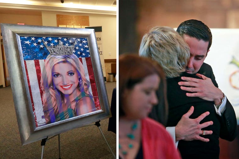 Keith Jones, the boyfriend of Cara McCollum (left), is embraced by a fellow mourner at her memorial service.