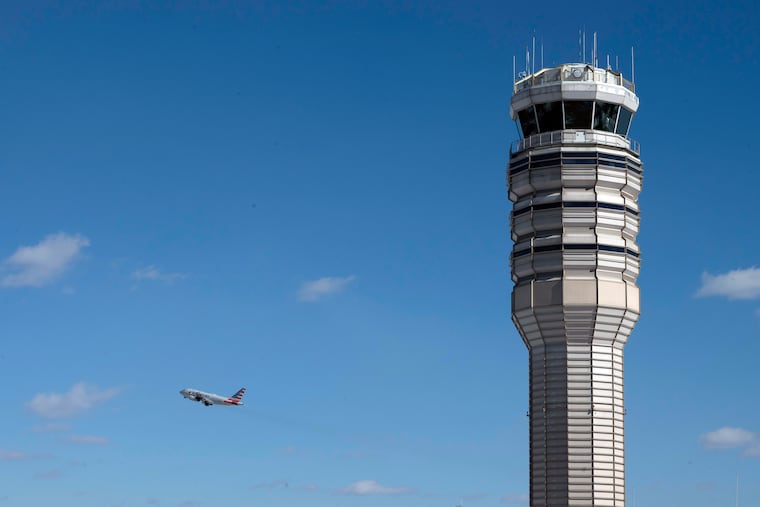 An jetliner takes off behind the control tower at Ronald Reagan Washington National Airport last month on the one-year anniversary of the Potomac River midair collision.