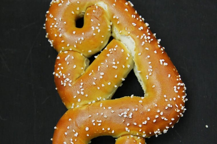 The Tebow pretzel shows the QB's praying posture. (Michael Bryant/Staff Photographer)