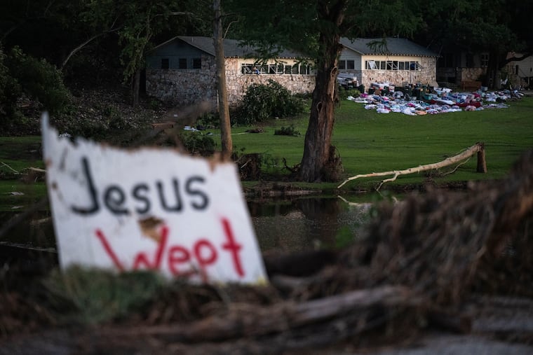 Campers belongings sit outside a cabin at Camp Mystic on Monday after flooding in Hunt, Texas.