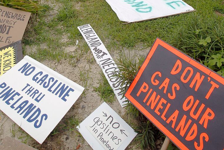 Protest signs lay at the N.J. Pinelands Commission office ground on July 26, 2013. ( AKIRA SUWA / Staff Photographer )