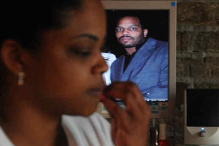 Keith Briscoe, background, was mentally ill when he died in a struggle with police. His sister, Sunny Brisco, foreground, said he wasn't violent.
(Curt Hudson / For the Daily News)