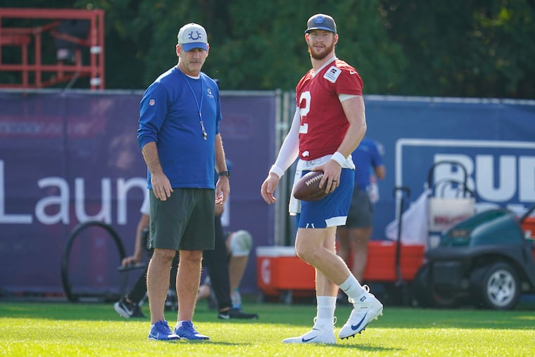 Colts quarterback Carson Wentz (2) talks with coach Frank Reich during practice at training camp. Wentz had just returned from an injury when he landed on the COVID list.