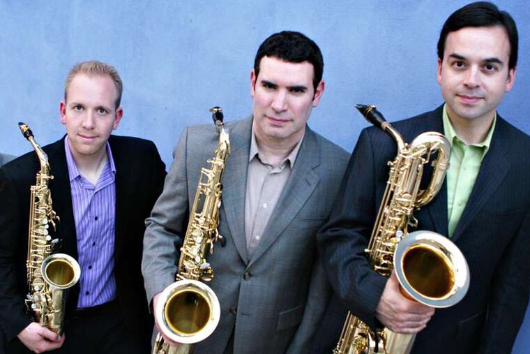 The Prism Quartet presented the program. From left: Zachary Shemon on alto, Matthew Levy on tenor, and Taimur Sullivan on baritone. not pictured: Timothy McAllister on soprano saxophone.