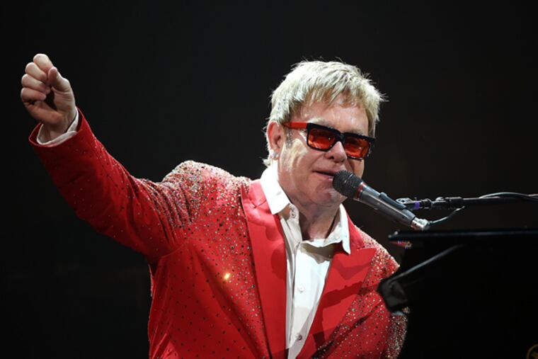 Elton John performs on Dick Clark's New Year's Rockin' Eve with Ryan Seacrest 2015 on December 31, 2014 in New York City.