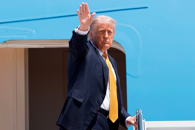 President Donald Trump waves from the stairs of Air Force One as he boards upon his arrival at Joint Base Andrews, Md., Tuesday, May 12, 2026, for a trip to China to meet President Xi Jinping.