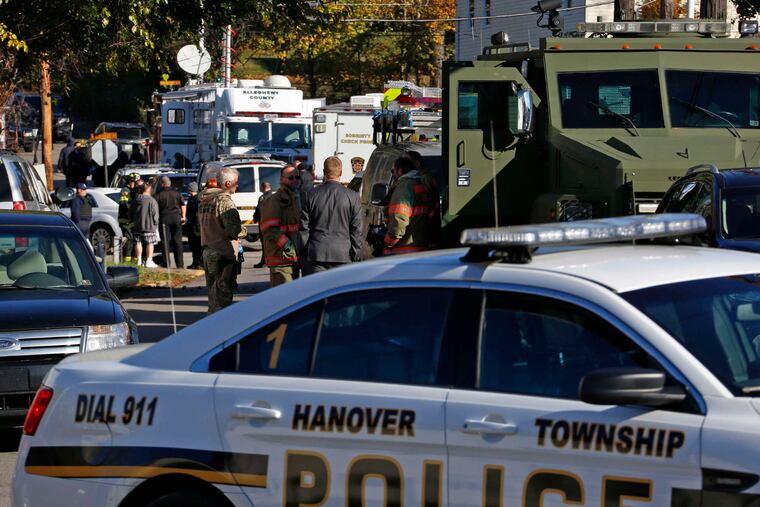 Police vehicles line streets near where two Canonsburg police officers were shot when they responded to a domestic call. Disputes had been reported before at the home.