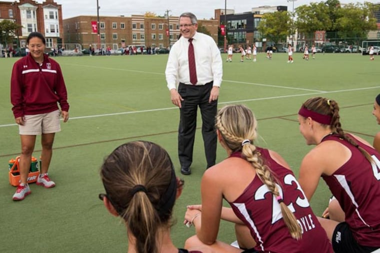 President Neil D. Theobald with the Temple women's field hockey team
before a match against Rutgers (Photo by Joseph V. Labolito/Temple University)