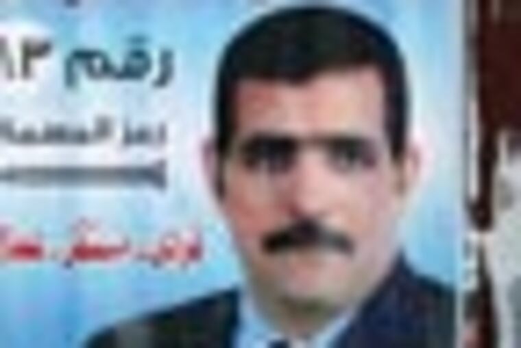 Egyptian voters leave a polling center as an army soldier stands guarding in Cairo, Egypt, Tuesday, Dec. 6, 2011. The runoff for Egypt's first-round parliamentary elections has heated up tensions between competing Islamist groups that have so far dominated the vote, with scuffles breaking out and allegations of death threats. Arbic election poster showing candidate Sayyed Ahmed Mohammed. (AP Photo/Khalil Hamra)