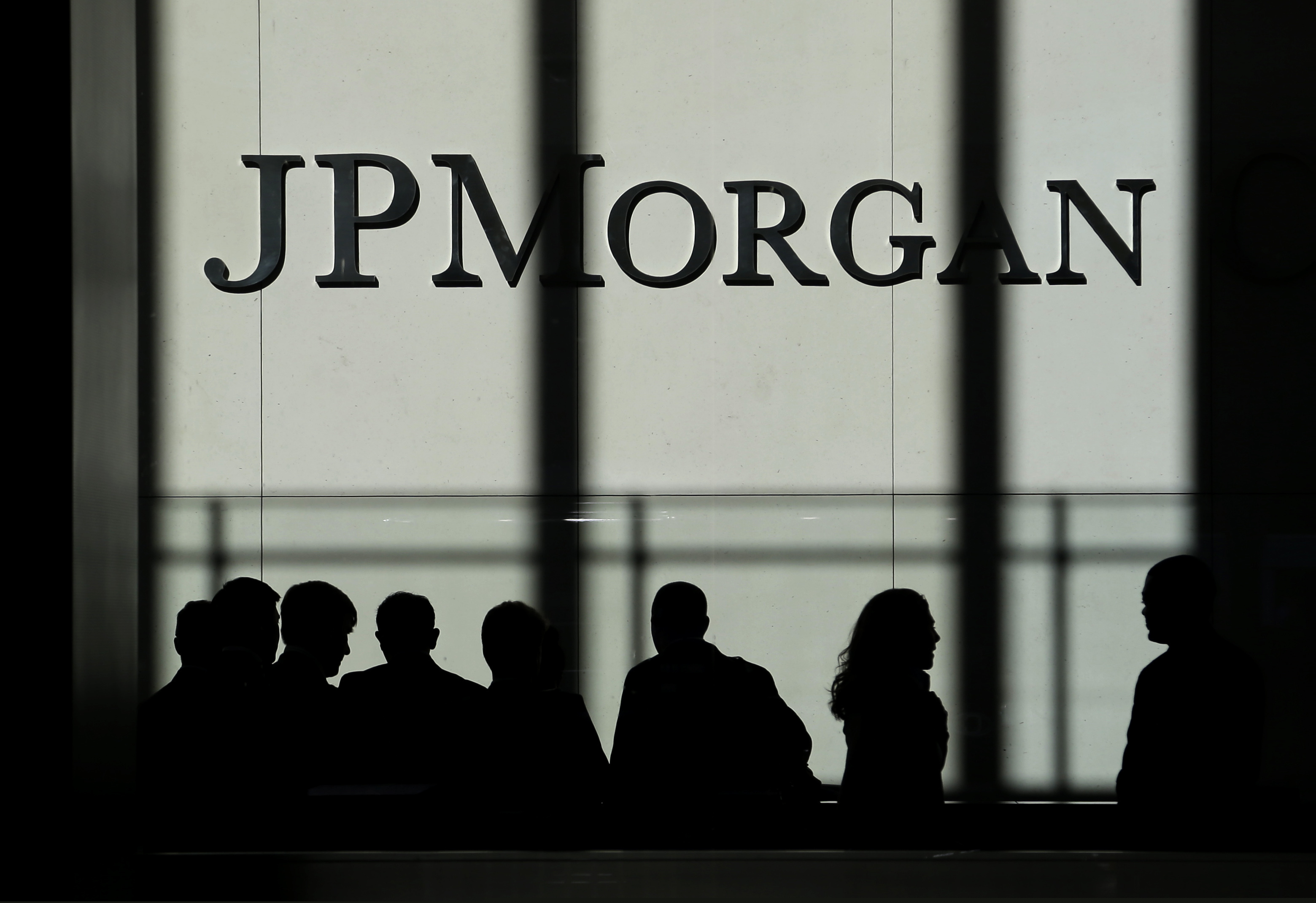 In this 2013, file photo, the JPMorgan Chase logo is displayed at their headquarters in New York. JPMorgan Chase & Co. told employees they could work from home at their managers' discretion in the first few weeks of the year. Staffers are expected to resume their in-office schedules by Feb. 1. (AP Photo/Seth Wenig, File)