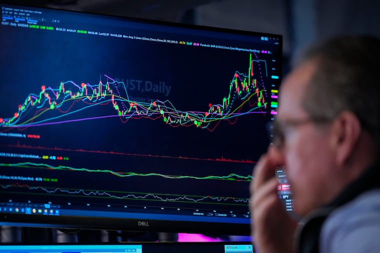 A trader works on the floor of the New York Stock Exchange on Thursday.