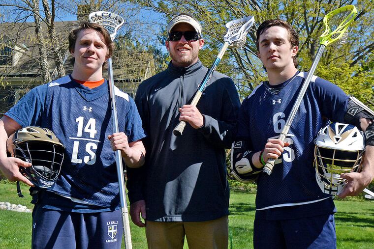 La Salle assistant coach Patrick Lacon (center) with his brothers Liam (left) and Kevin.