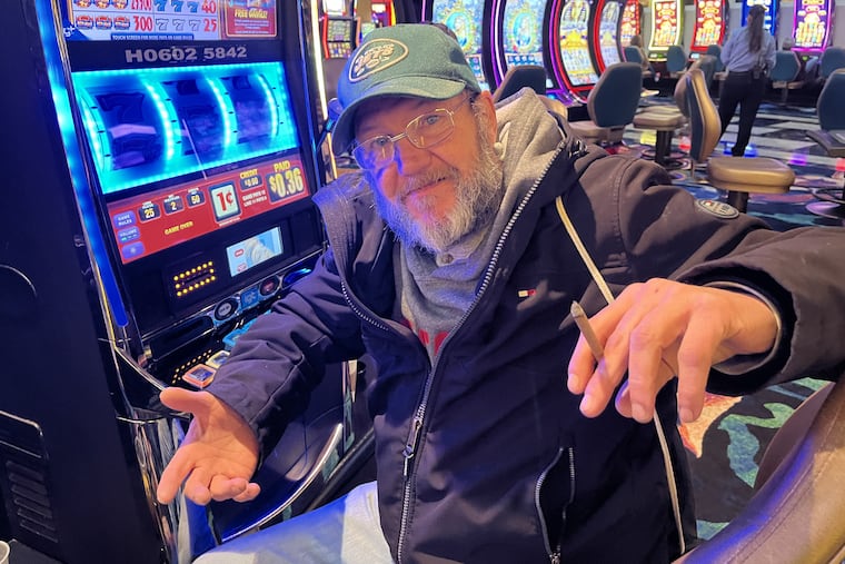 Bob Hafner, 56, of Long Beach Island, smoking an organic Cheyenne cigar at the slots inside Tropicana Hotel & Casino in Atlantic City on Sunday. A state senate committee is due to vote Monday on a total smoking ban inside Atlantic City's casinos.